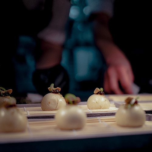 One of our signature canapés in the making - and finalized. Bao buns filled with Bavarian corn chicken, ponzu sauce,...